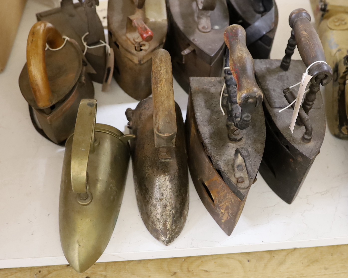 Nine various slug irons, tallest 22cm
